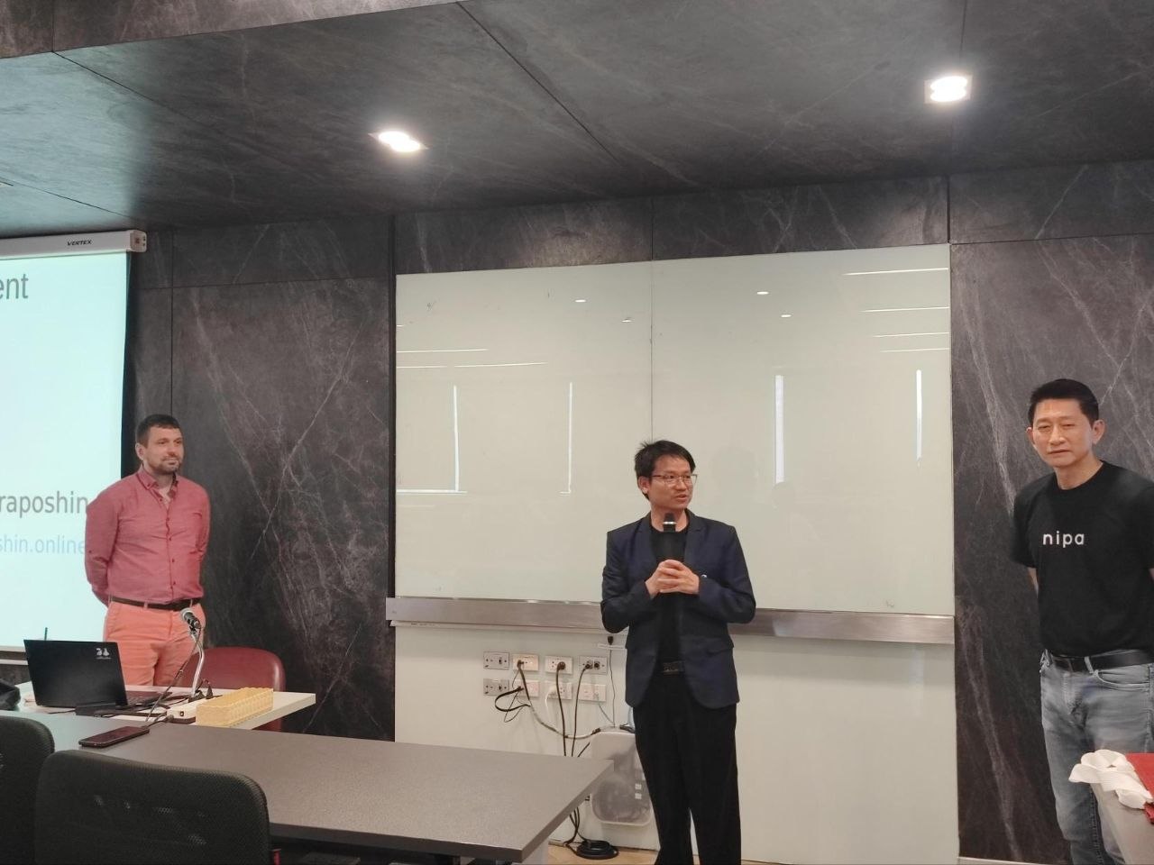 The lecturer, the Chulalongkorn and Nipa representatives.
